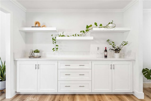 22287 Modina, Laguna Hills, CA 92653 - indoor dry bar with ornamental molding and light wood-style flooring
