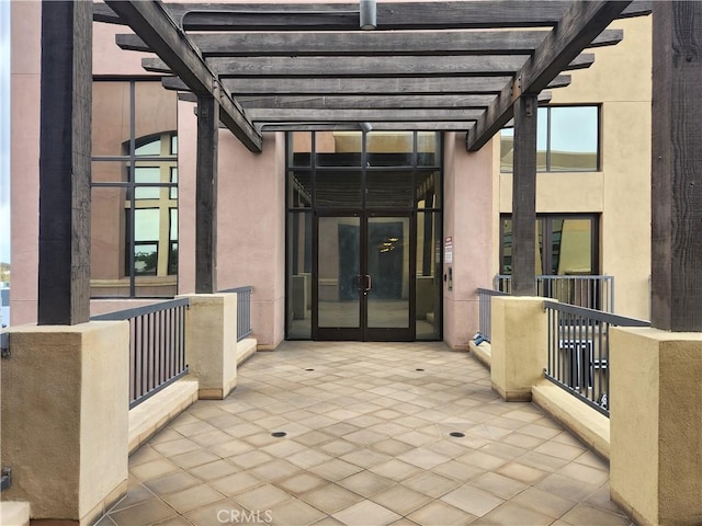 101 W Mission Blvd Unit 306, Pomona, CA 91766 - view of patio / terrace featuring french doors and a pergola