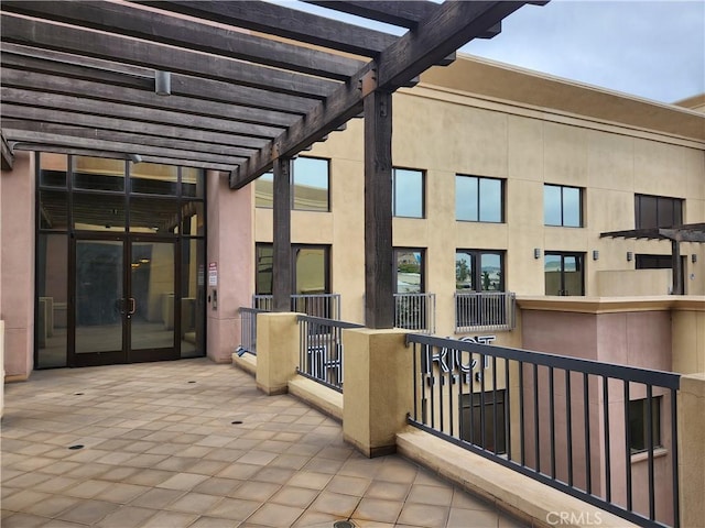 101 W Mission Blvd Unit 306, Pomona, CA 91766 - view of patio with a pergola and french doors
