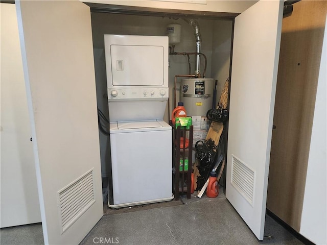 101 W Mission Blvd Unit 306, Pomona, CA 91766 - laundry room with stacked washing machine and dryer and strapped water heater