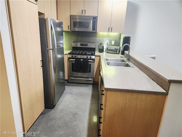 101 W Mission Blvd Unit 306, Pomona, CA 91766 - kitchen with appliances with stainless steel finishes, backsplash, light countertops, a peninsula, and finished concrete floors