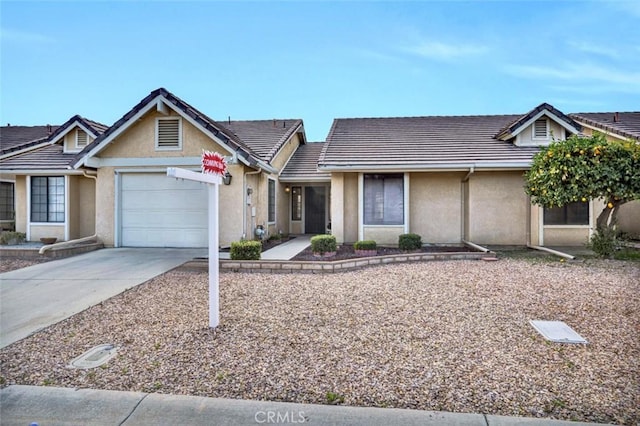 1454 Congress Way, San Jacinto, CA 92583 - single story home with stucco siding, a tiled roof, driveway, and a garage
