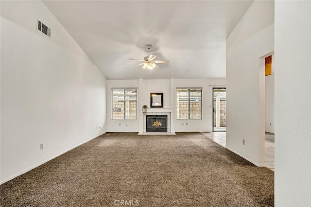 1454 Congress Way, San Jacinto, CA 92583 - unfurnished living room featuring a ceiling fan, visible vents, a fireplace, carpet floors, and baseboards