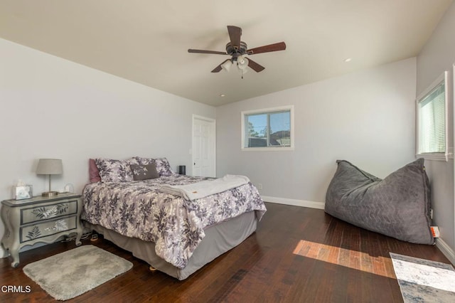 bedroom with a ceiling fan, baseboards, and hardwood / wood-style floors