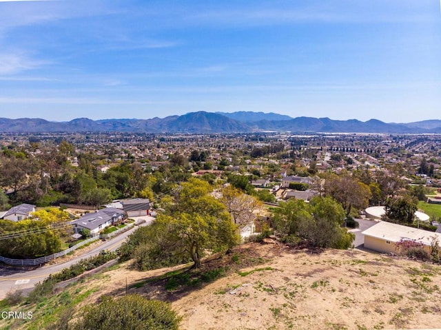 drone / aerial view featuring a mountain view