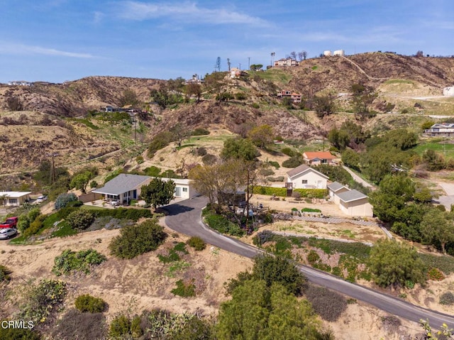 birds eye view of property featuring a mountain view