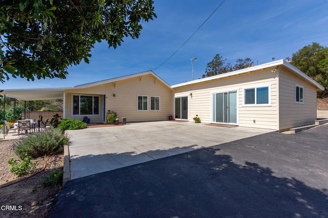 back of house with a patio area