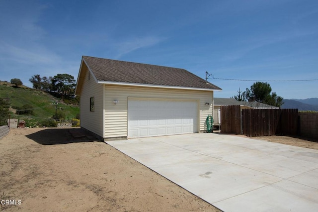 detached garage with fence