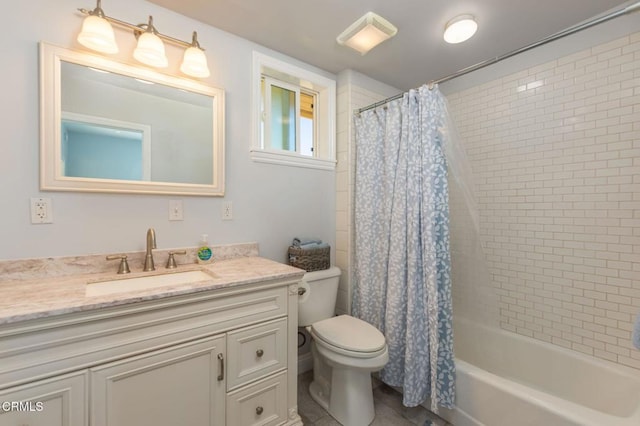 full bathroom with vanity, shower / bath combination with curtain, toilet, and tile patterned floors