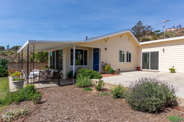rear view of house featuring a patio area
