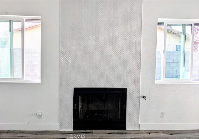 67685 Verona Rd, Cathedral City, CA 92234 - details with wood finished floors, a fireplace, and baseboards