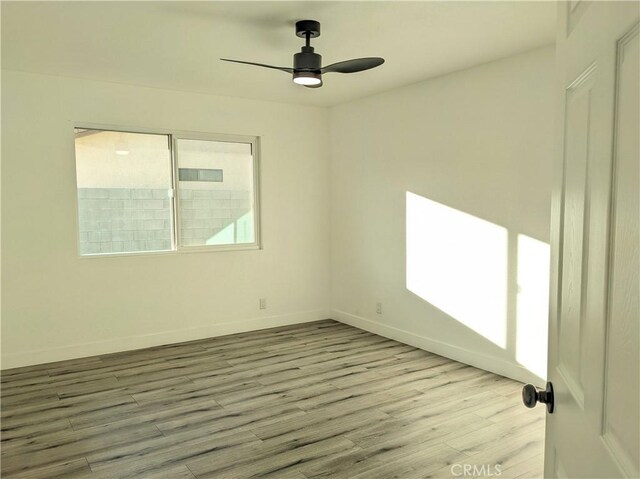 67685 Verona Rd, Cathedral City, CA 92234 - unfurnished room featuring baseboards, a ceiling fan, and wood finished floors