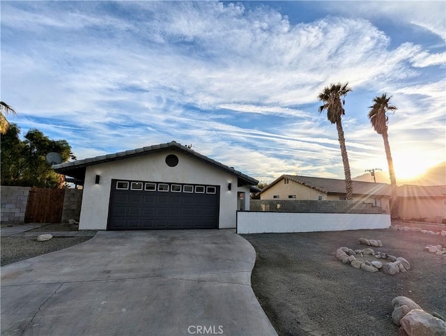 67685 Verona Rd, Cathedral City, CA 92234 - garage featuring driveway and fence