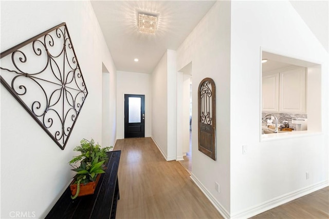4 Malaquita, Coto De Caza, CA 92679 - hall featuring light wood finished floors, baseboards, recessed lighting, and a sink