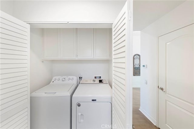 4 Malaquita, Coto De Caza, CA 92679 - laundry area featuring cabinet space, washer and dryer, and light wood-type flooring