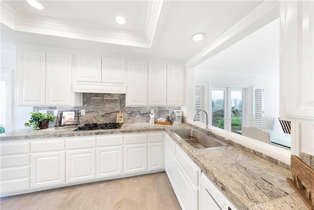 4 Malaquita, Coto De Caza, CA 92679 - kitchen with ornamental molding, tasteful backsplash, black gas cooktop, a raised ceiling, and a sink