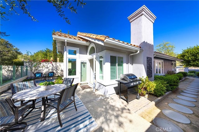 4 Malaquita, Coto De Caza, CA 92679 - rear view of house with outdoor dining area, a tiled roof, fence, and a patio area