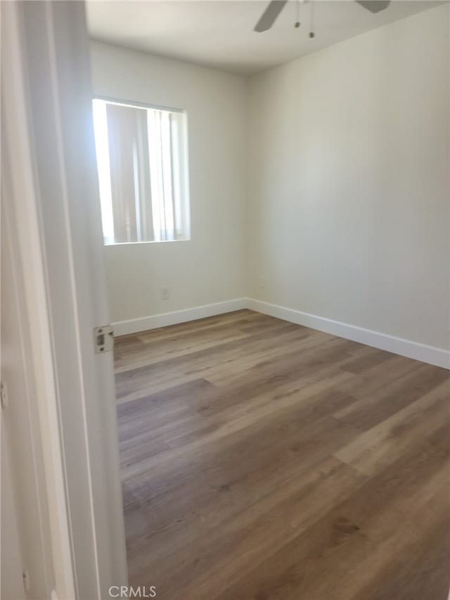7524 Matterhorn Ave, Rancho Cucamonga, CA 91730 - empty room with ceiling fan and wood finished floors