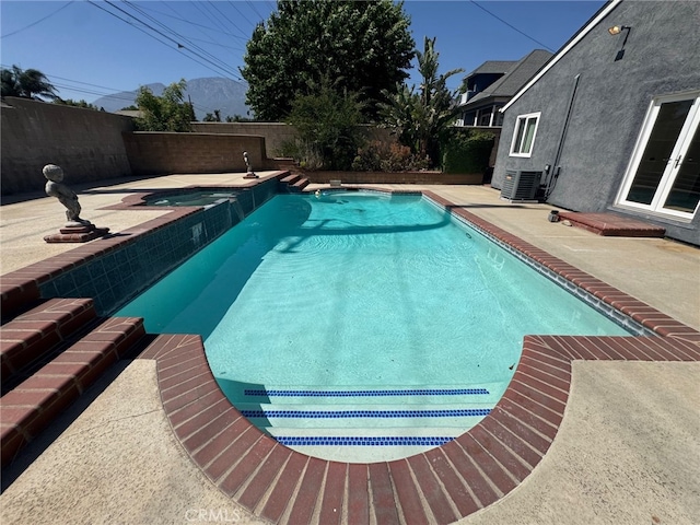 7524 Matterhorn Ave, Rancho Cucamonga, CA 91730 - view of swimming pool with a fenced backyard, a patio area, and a pool with connected hot tub