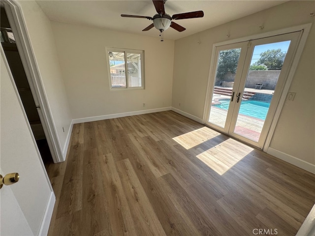 7524 Matterhorn Ave, Rancho Cucamonga, CA 91730 - spare room with french doors, plenty of natural light, wood finished floors, and a ceiling fan