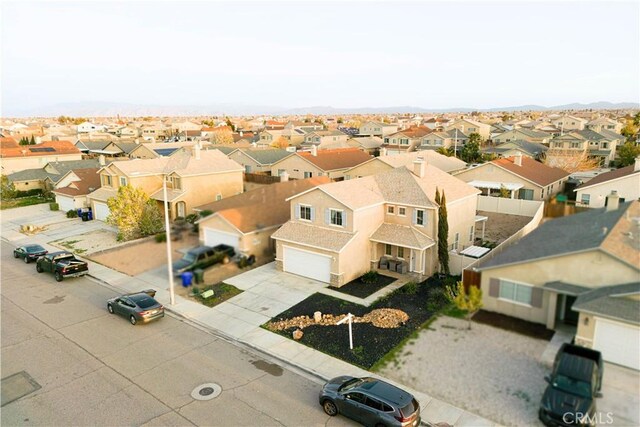 birds eye view of property with a residential view