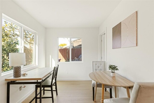 home office featuring light wood-style floors and baseboards