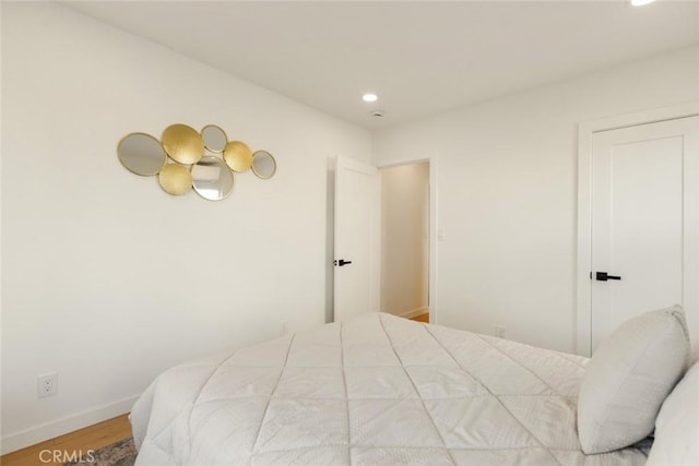 bedroom featuring recessed lighting, baseboards, and wood finished floors