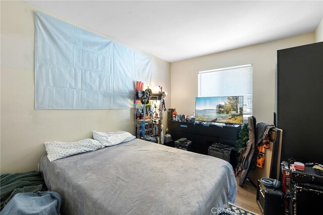 bedroom featuring wood finished floors