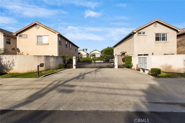 view of street featuring a gate and a residential view