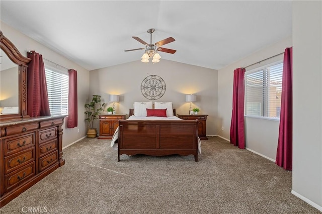 bedroom with light colored carpet, multiple windows, and lofted ceiling