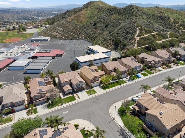 drone / aerial view featuring a residential view and a mountain view