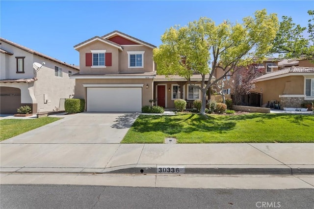 traditional home with an attached garage, driveway, stucco siding, and a front yard