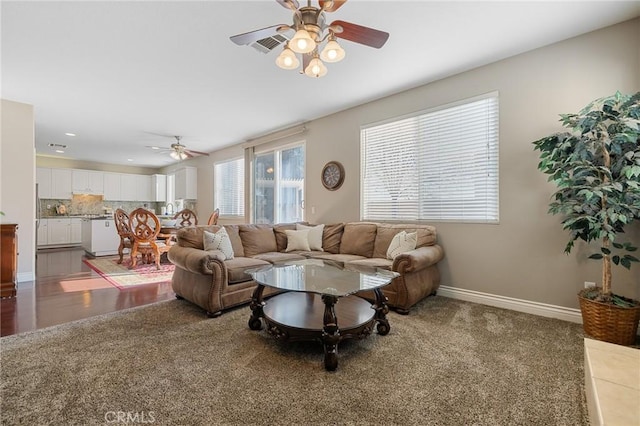 carpeted living room with recessed lighting, baseboards, and ceiling fan