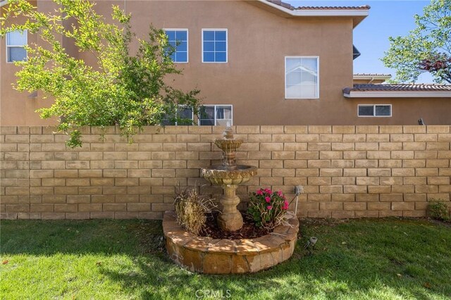 view of home's exterior featuring a tiled roof and stucco siding