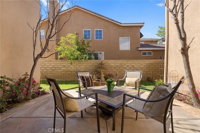 view of patio featuring fence