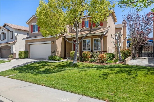 traditional-style house featuring a garage, stucco siding, concrete driveway, and a front lawn