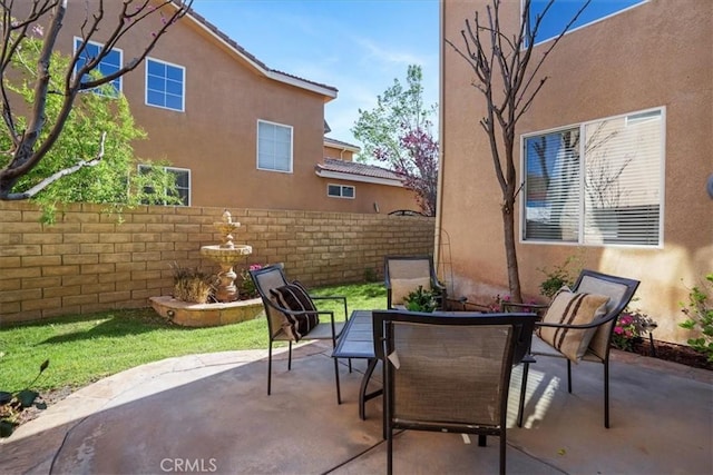 view of patio / terrace featuring fence