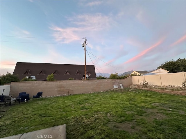 view of yard with a fenced backyard