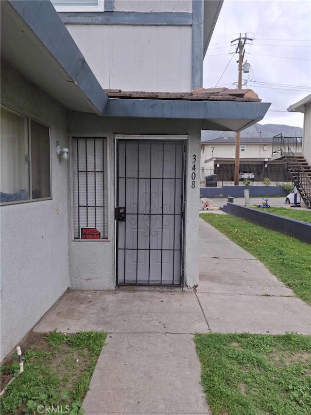 3408 20th St, Highland, CA 92346 - property entrance with stucco siding