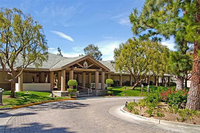 surrounding community with a yard