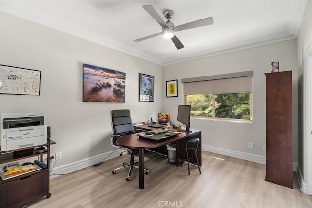 office featuring light wood-style floors, baseboards, crown molding, and a ceiling fan