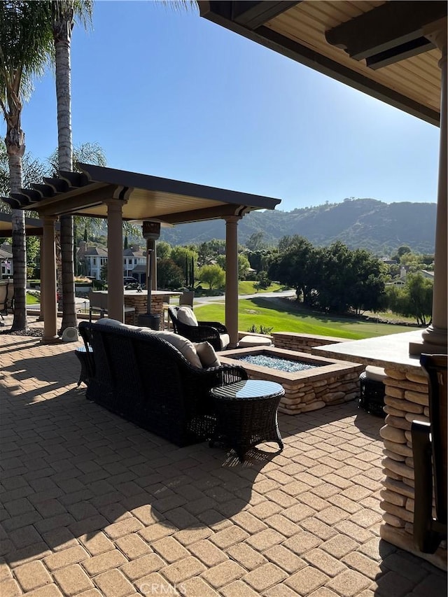 view of patio with a mountain view