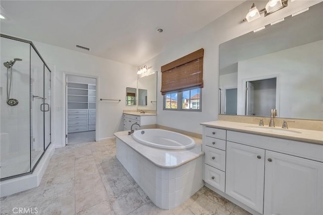 37 Fanpalm, Irvine, CA 92620 - full bath featuring a stall shower, two vanities, a garden tub, and a walk in closet