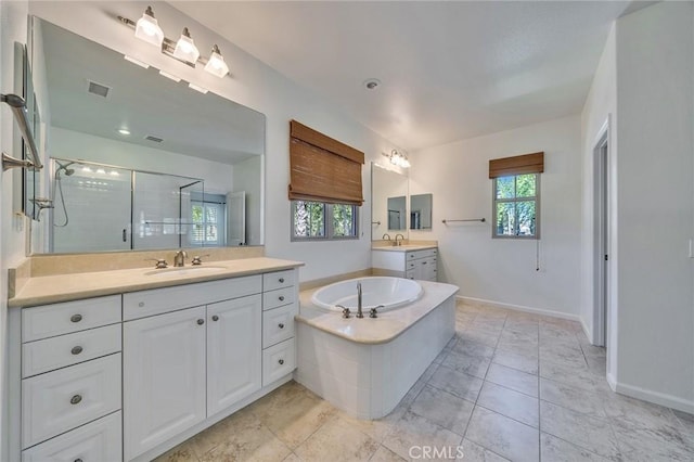 37 Fanpalm, Irvine, CA 92620 - full bath with a shower stall, two vanities, healthy amount of natural light, and a garden tub