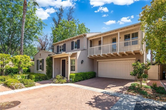 37 Fanpalm, Irvine, CA 92620 - view of front of property featuring a garage, stucco siding, and decorative driveway