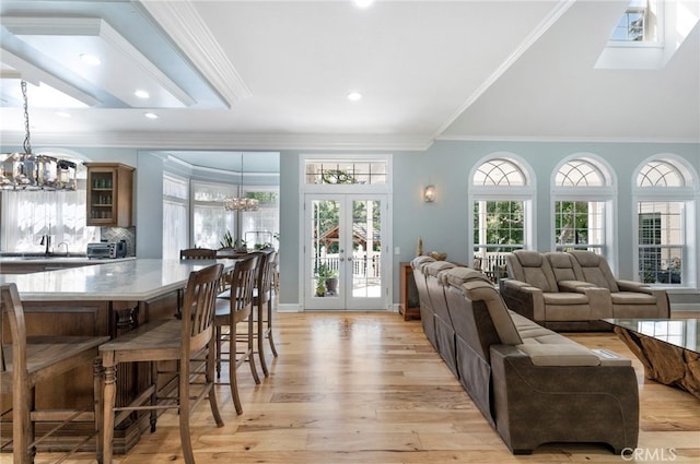 45325 Via Vaquero, Temecula, CA 92590 - living area with a chandelier, light wood-style flooring, french doors, recessed lighting, and ornamental molding