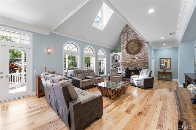 45325 Via Vaquero, Temecula, CA 92590 - living area with light wood-style floors, a brick fireplace, plenty of natural light, a skylight, and crown molding