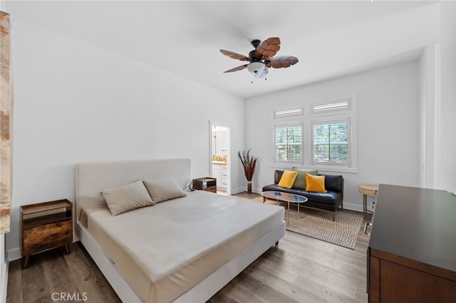 45325 Via Vaquero, Temecula, CA 92590 - bedroom with light wood-style flooring, baseboards, a ceiling fan, and ensuite bath