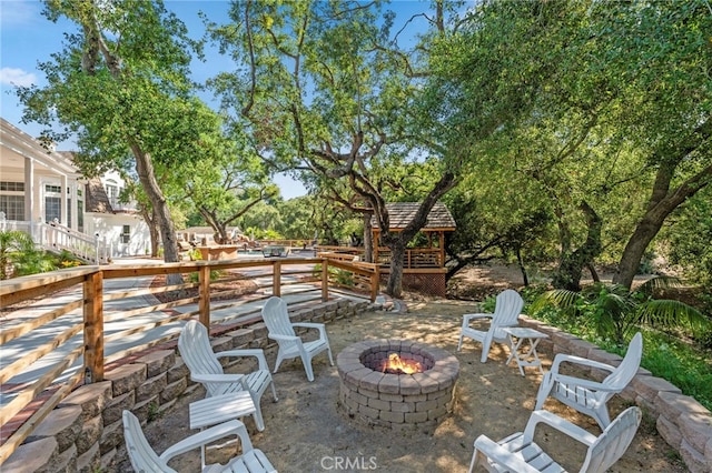 view of patio / terrace featuring a fire pit