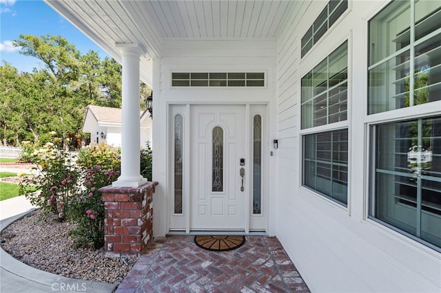 entrance to property featuring covered porch